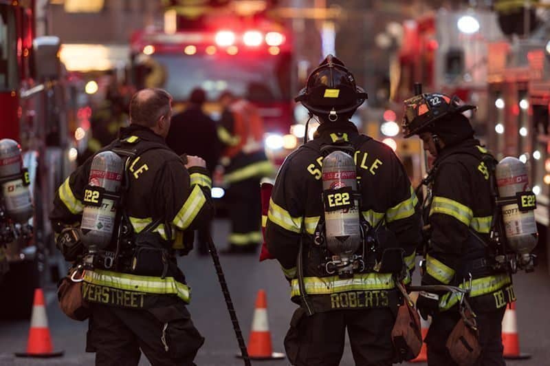 Seattle Fire Seattle, USA - January 5, 2017: Firefighter at 1919 on 1st avenue late in the day by Pike Place Market after putting out a fire.