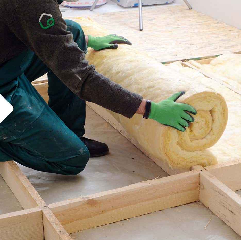 Envelope-Insulation Installer rolling out insulation