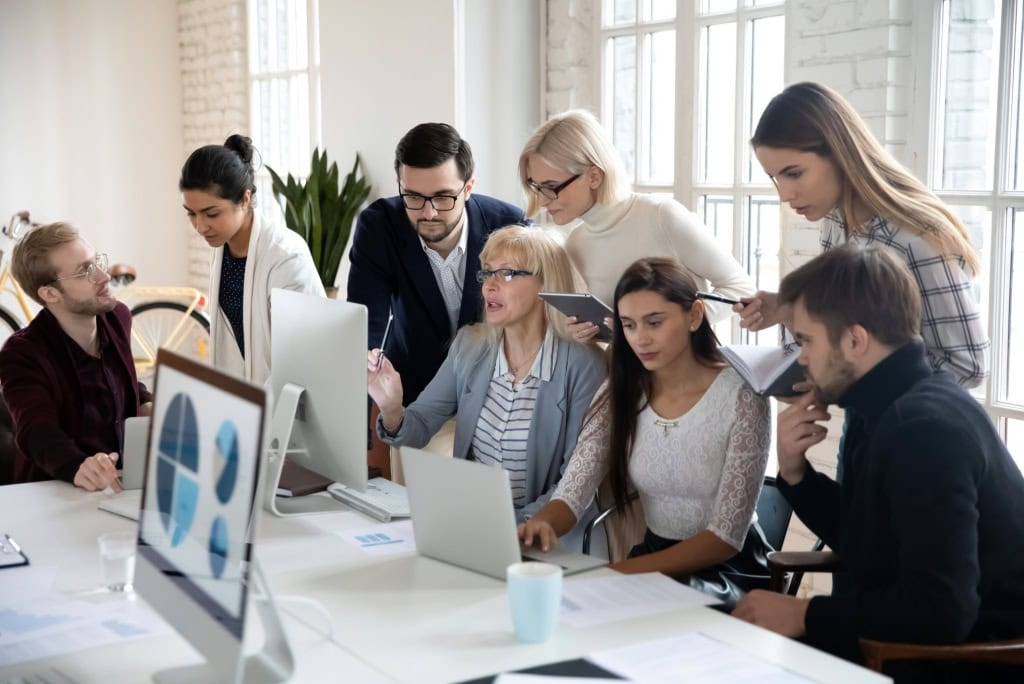 Why is coworking beneficial for startups; a crowded office of busy employees highlights the need to start looking for new office space if you are experiencing overcrowding.