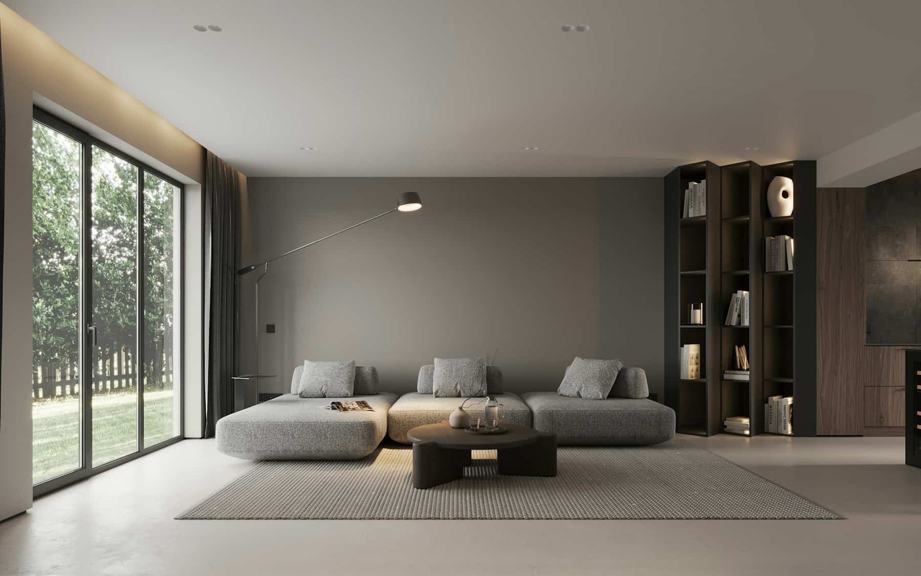 Bright contemporary living room with large windows and layered seating zones.