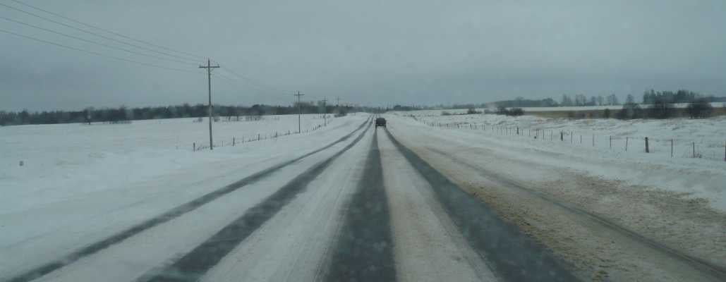 rural orangeville area snow covered road