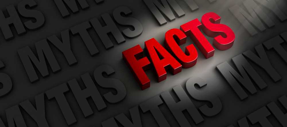 the word facts spotlighted surrounded by myths in darkness
