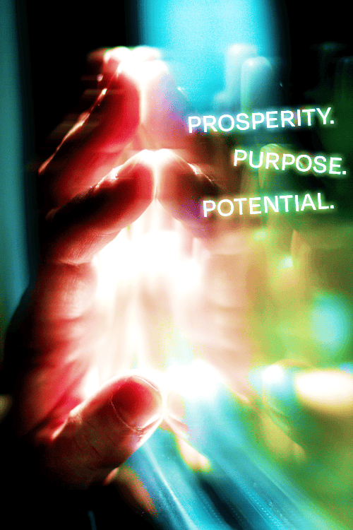 Image of a hand touching it's reflection with the words: "Prosperity. Purpose. Potential."