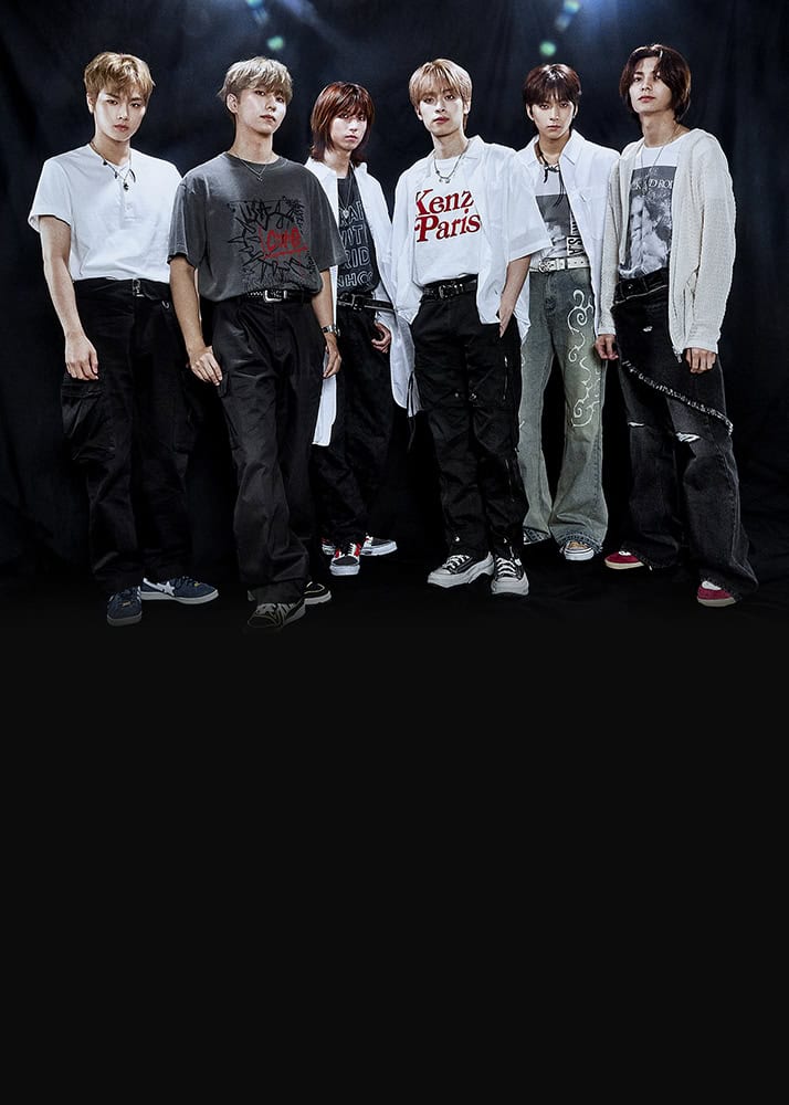 Members of K-rock band Xdinary Hereos stand together in a row, with the band name above them in silver.