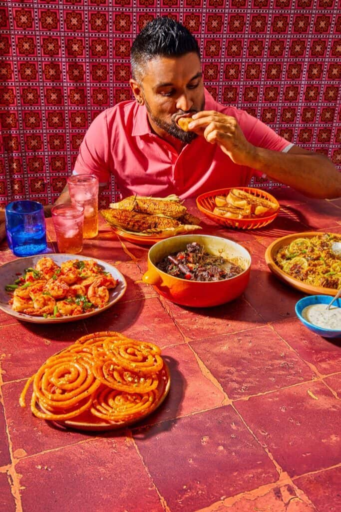 Chef Dev Rajkumar eating Indo-Guyanese cuisine.