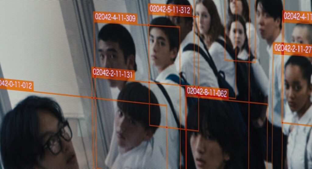Still from "Happyend." A group of students are being identified by surveillance technology.