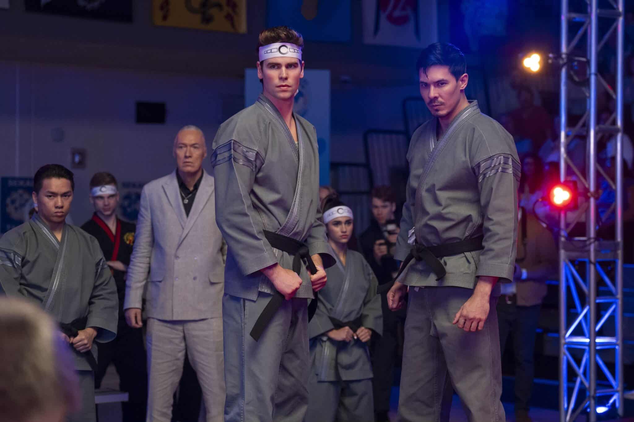 Patrick Luwis as Axel and Lewis Tan as Sensei Wolf in "Cobra Kai."