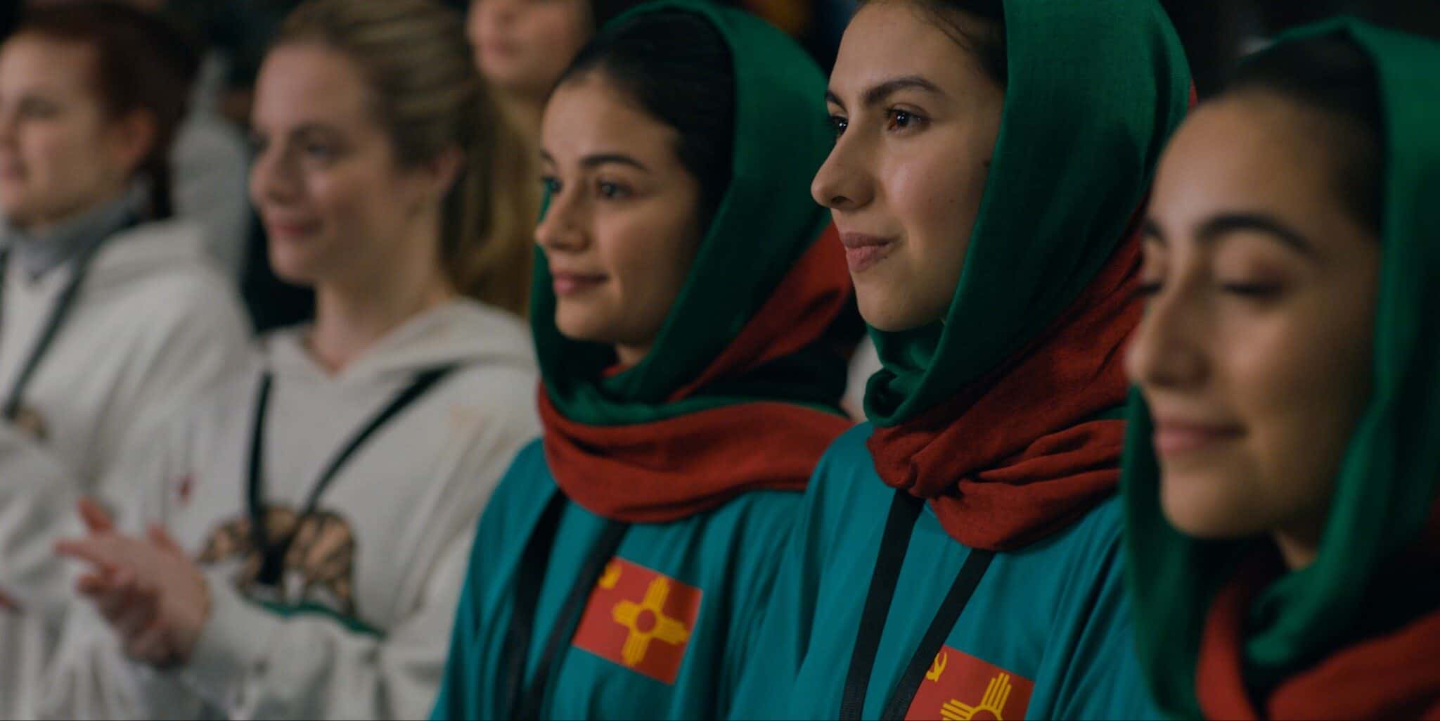 Still frame from "Rule Breakers"; A group of women stand together, side by side.