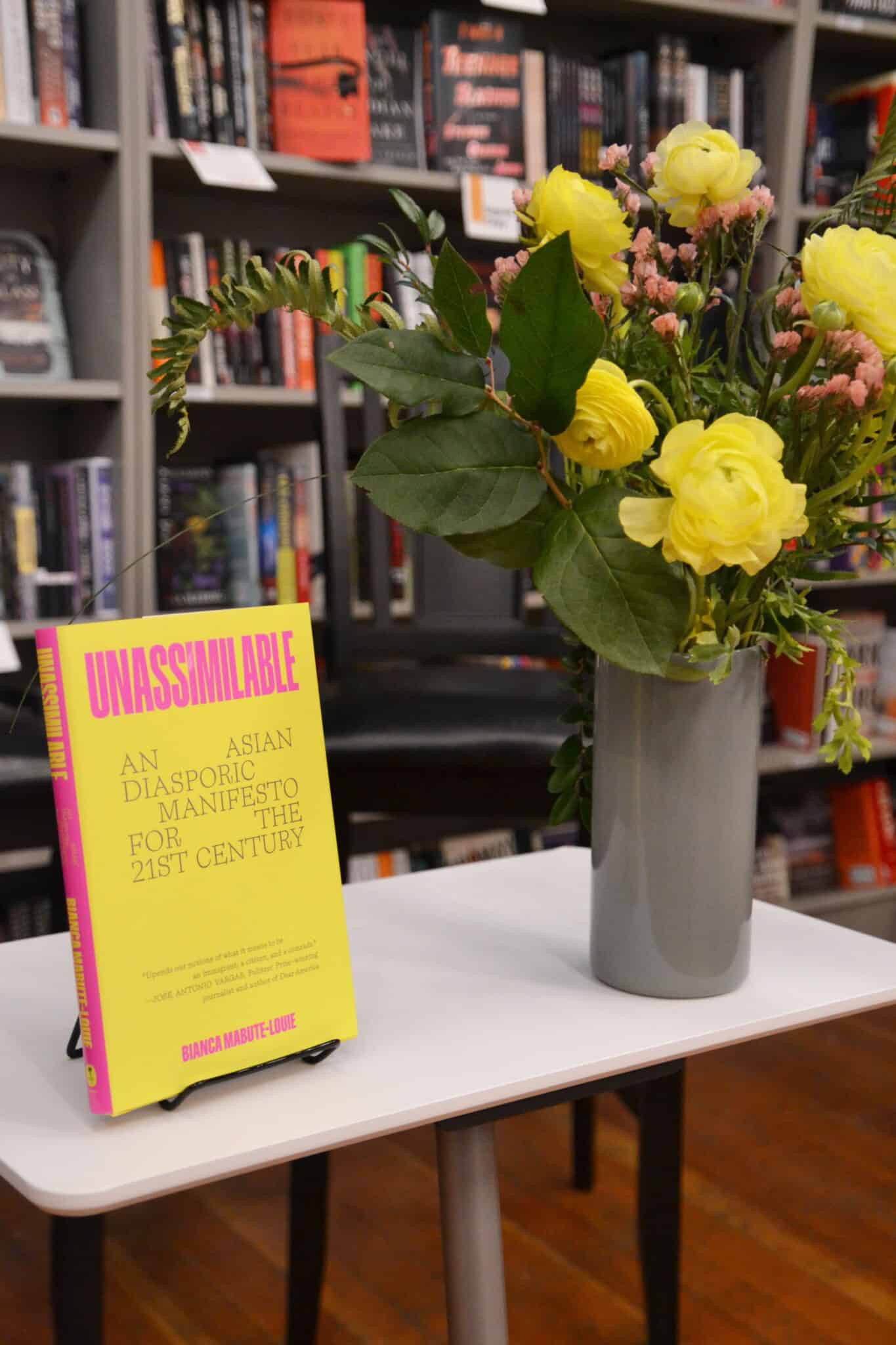 "Unassimilable" propped up on a table at a book signing.