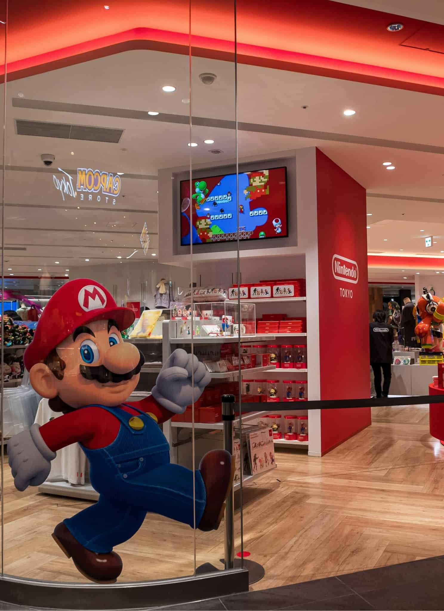 Nintendo store with Mario sticker out front and lots of red displays.
