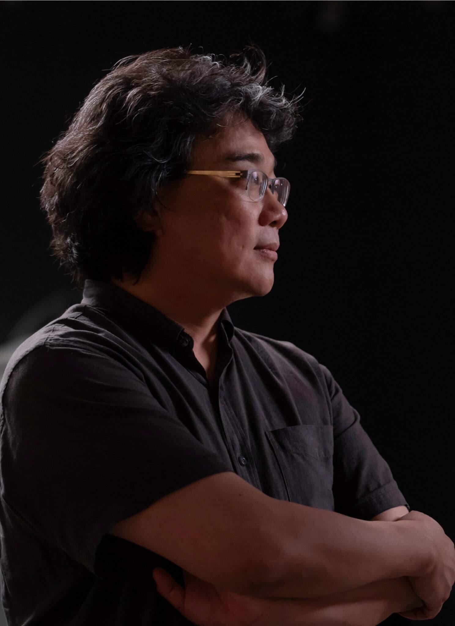 Bong Joon Ho in black shirt inside the Academy Museum.