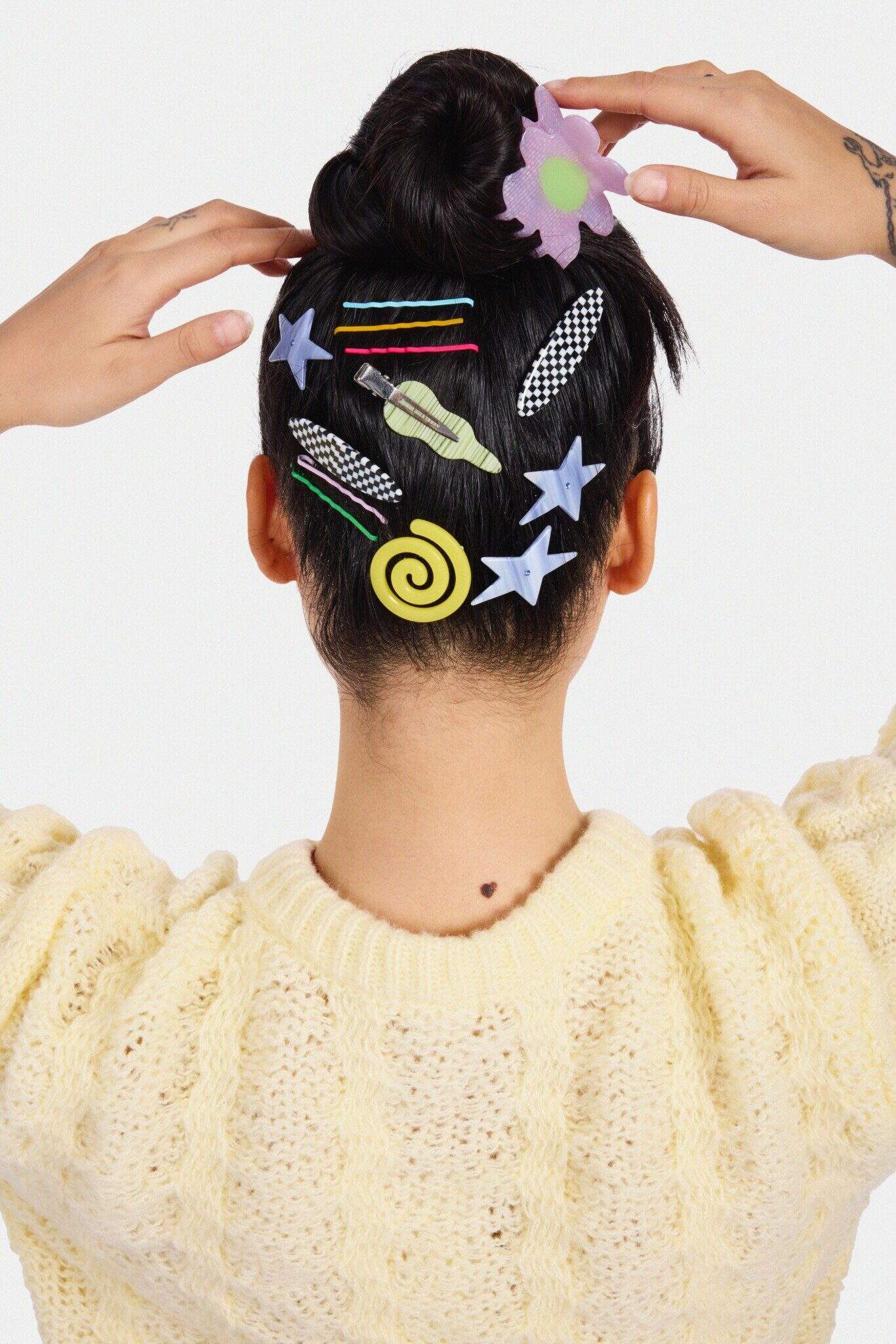 Someone facing away from the camera, adjusting their Chunks hair accessories.