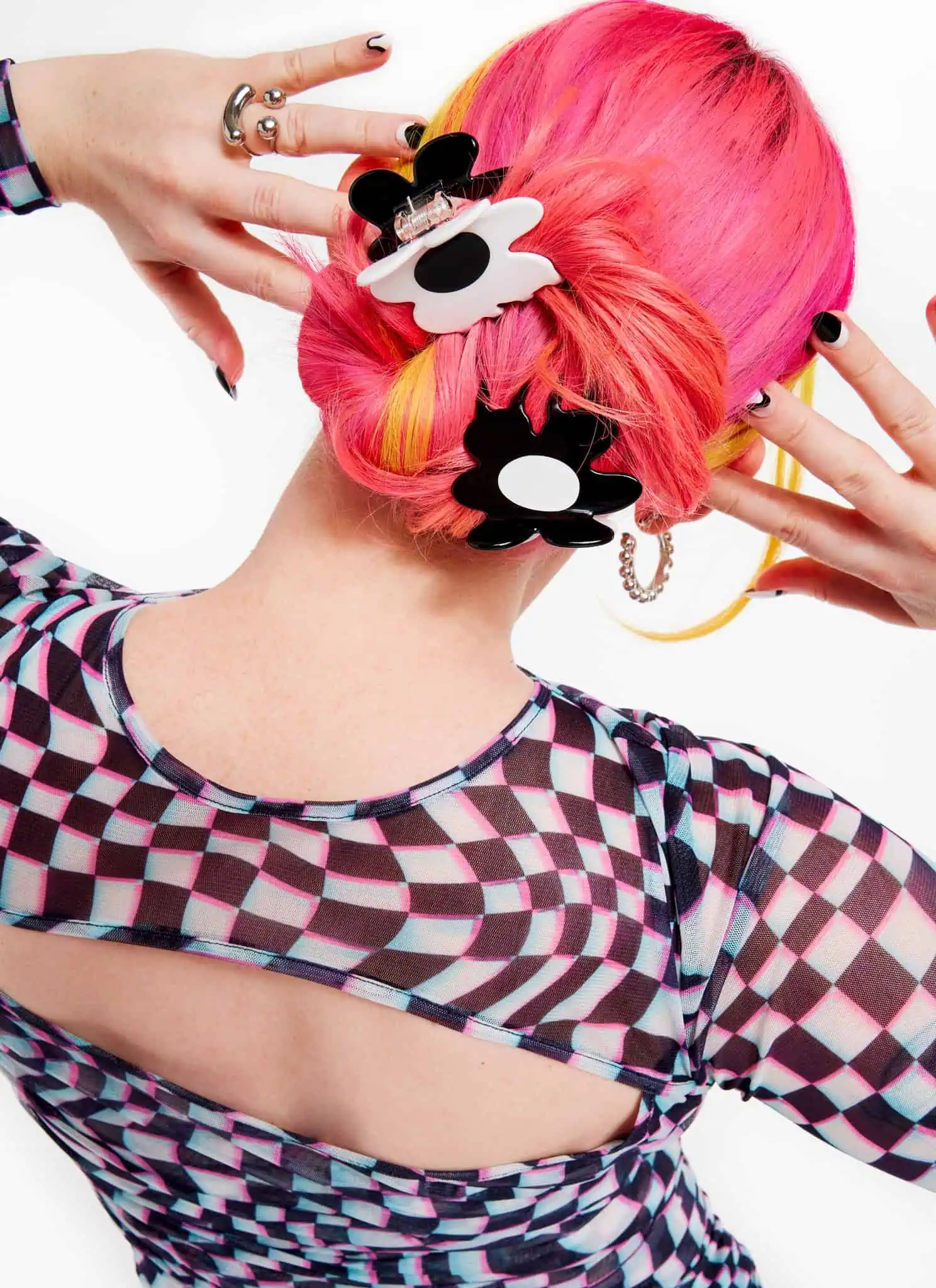 Pink-haired person wearing Chunks hair clips.