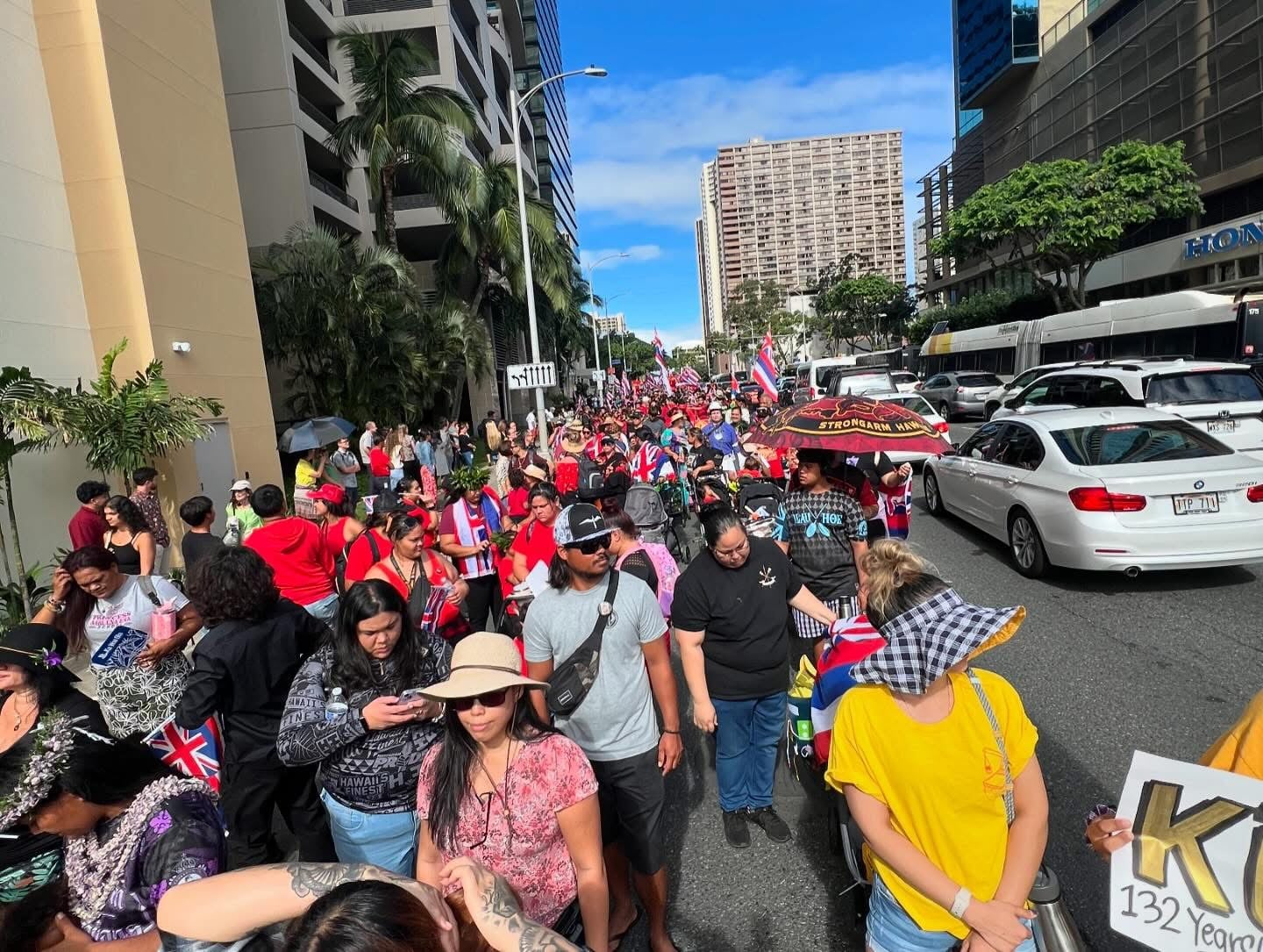 A group of Native Hawaiians on the street protesting.
