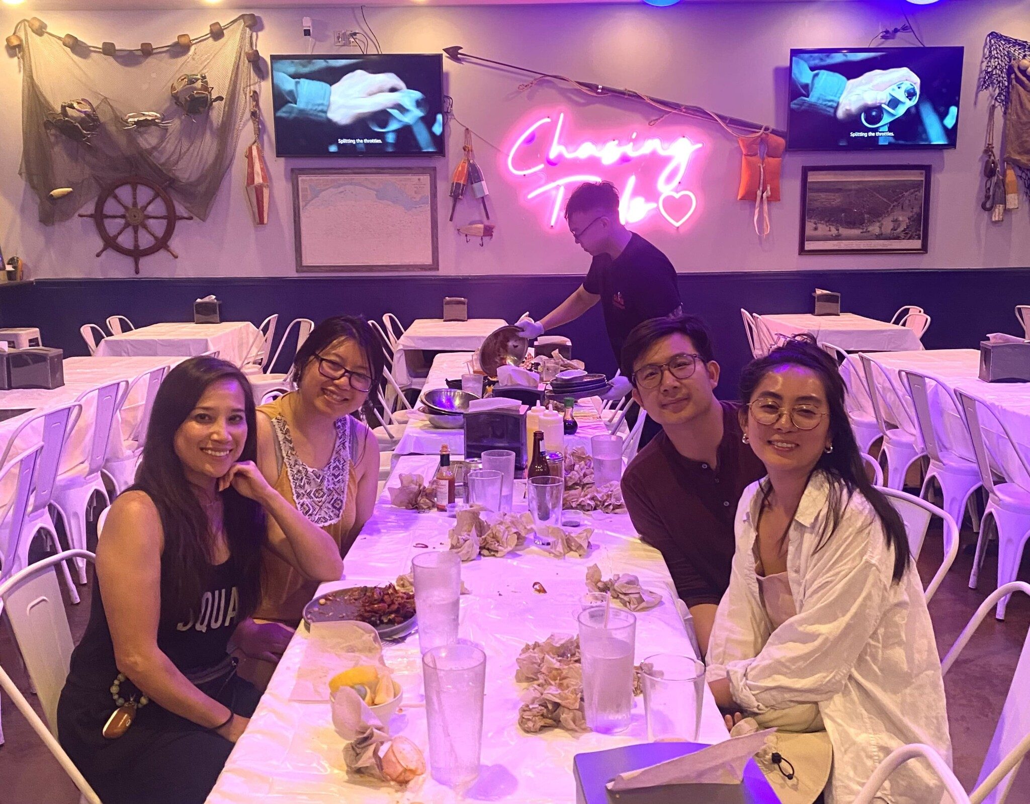 From left, Dr. Thao Ha, Jes Vũ, Charles Lam, and Carolyn Huynh getting crawfish.