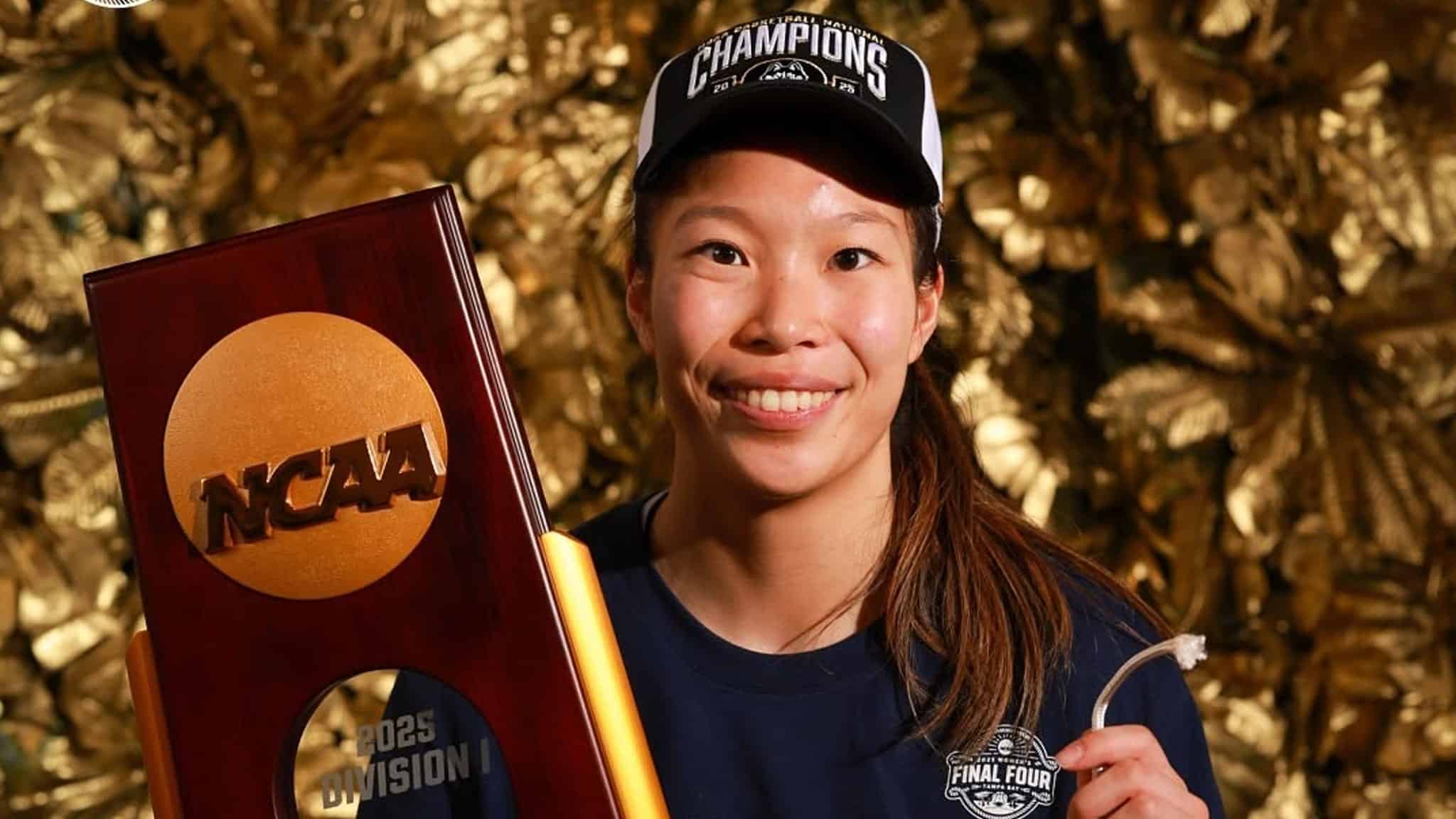 Kaitlyn Chen holding NCAA trophy.