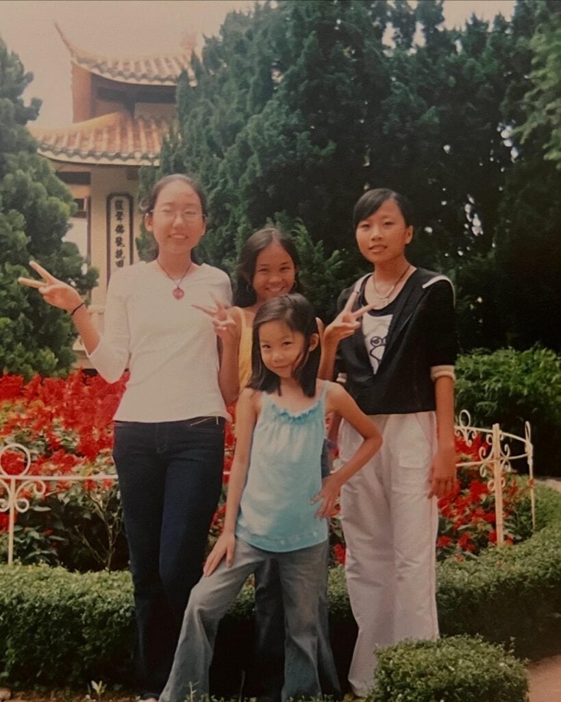 Teresa Tran (pictured in blue) in 2004 with her cousins in Vietnam.