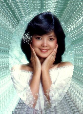 Teresa Teng holding her face in her hands.