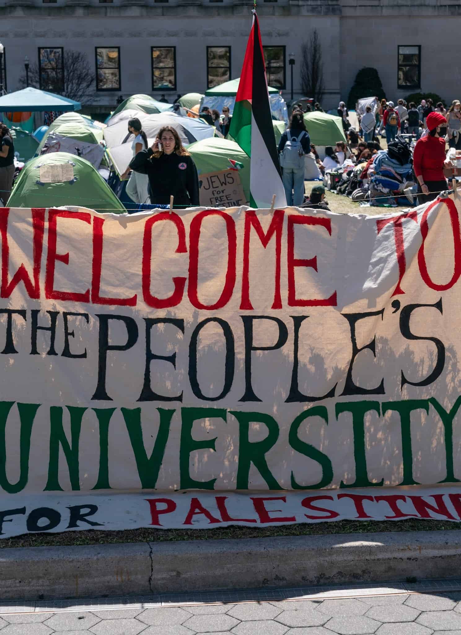 Pro-Palestinian supporters set up a protest encampment on the campus of Columbia University in New York as seen on April 22, 2024; a sign reads: "WELCOME TO THE PEOPLE'S UNIVERSITY FOR PALESTINE."