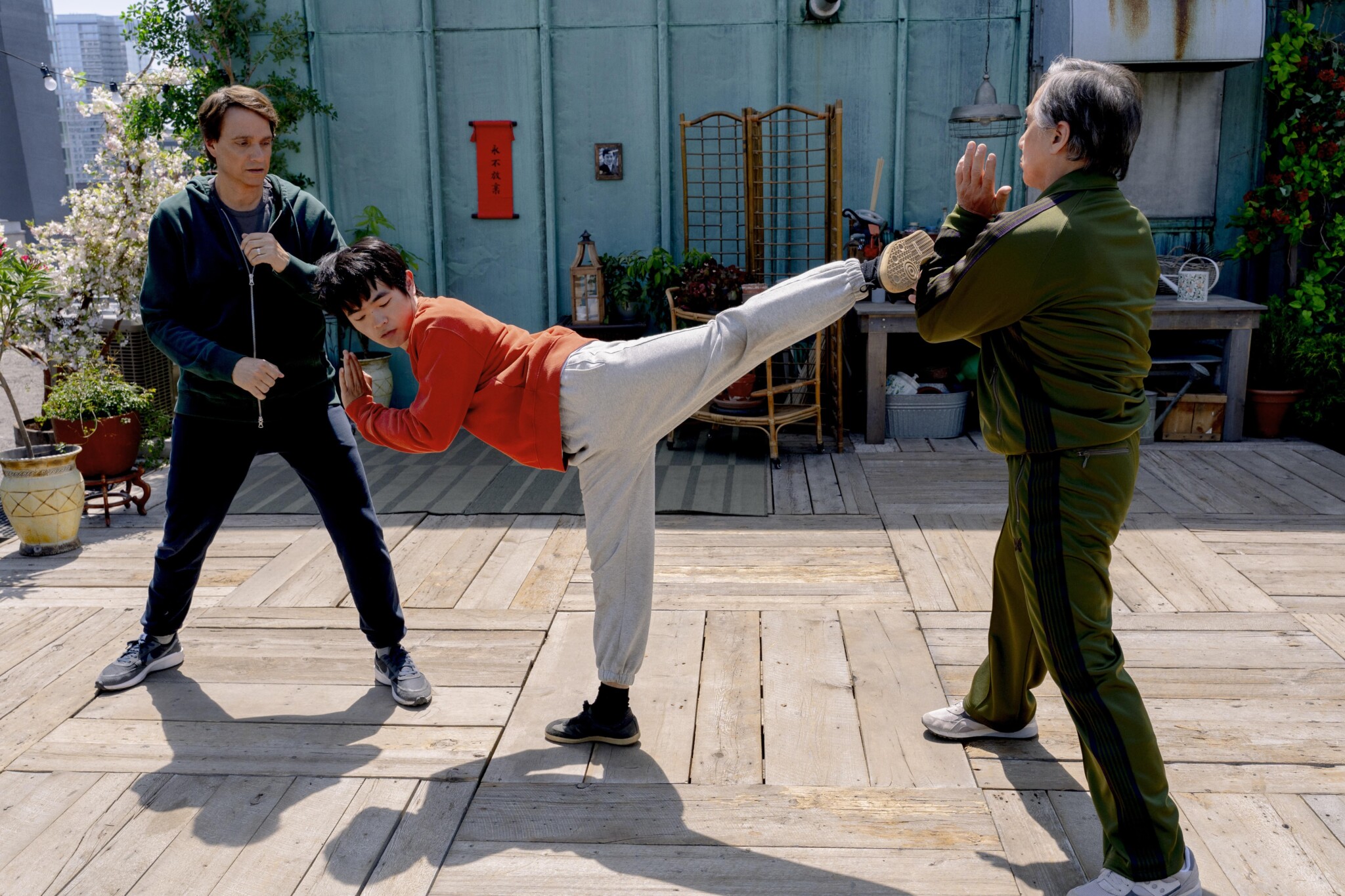 From left, Ralph Macchio, Ben Wang and Jackie Chan in "Karate Kid: Legends."