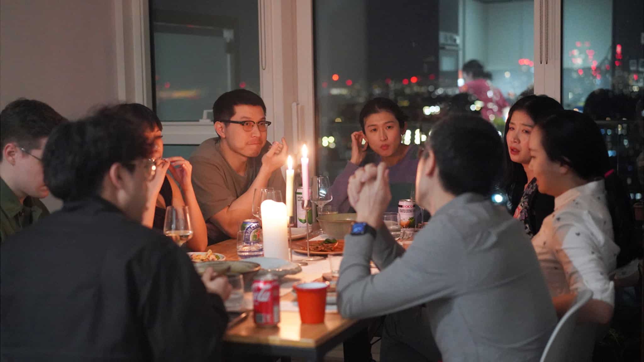 People sitting at a dinner table together.