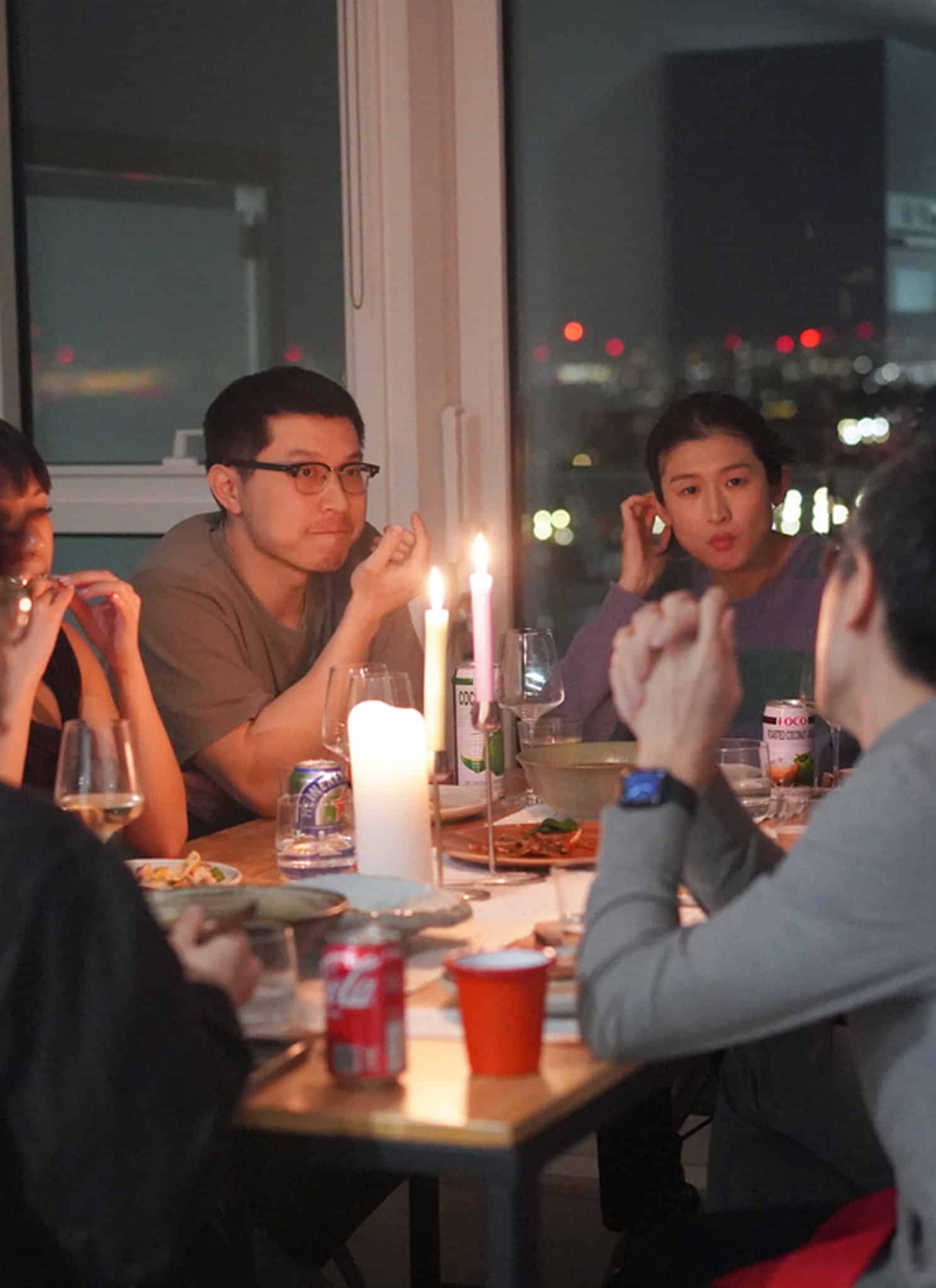 People sitting at a dinner table together.