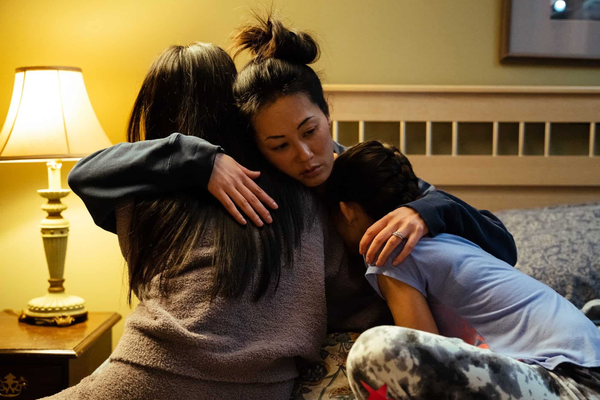 Three women hugging in "Lucky Star."