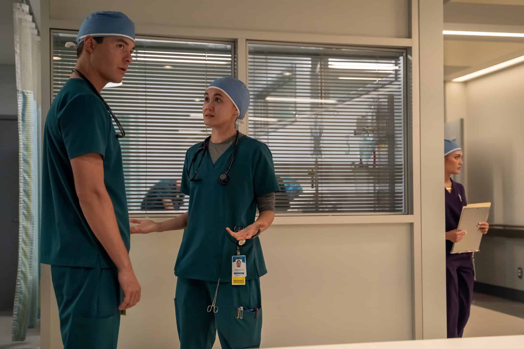 Jack Bannon and Chelsea Muirhead in teal hospital scrubs on "Pulse."