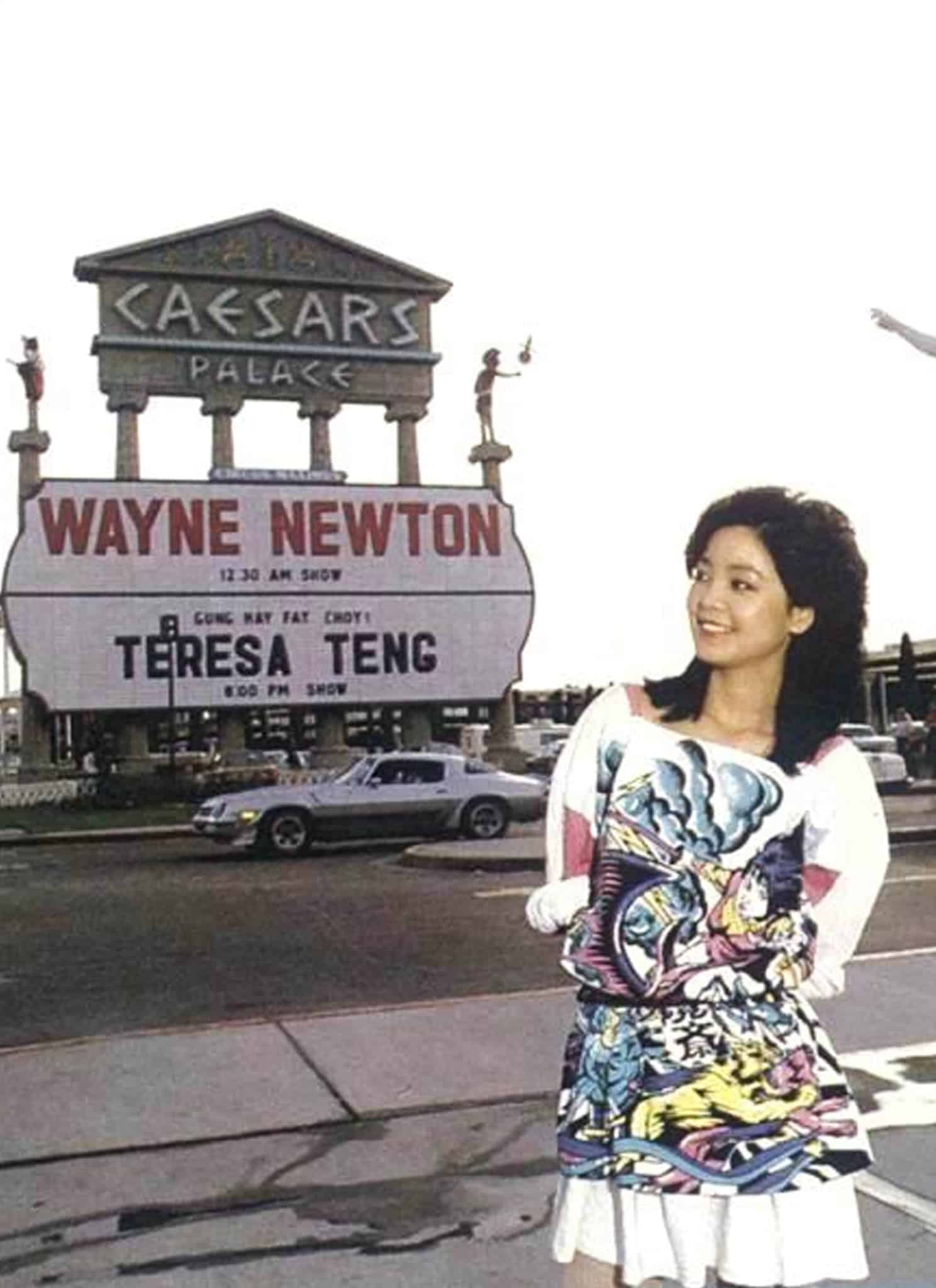 Teresa Tang standing in front of a Caesars Palace sign displaying her name.