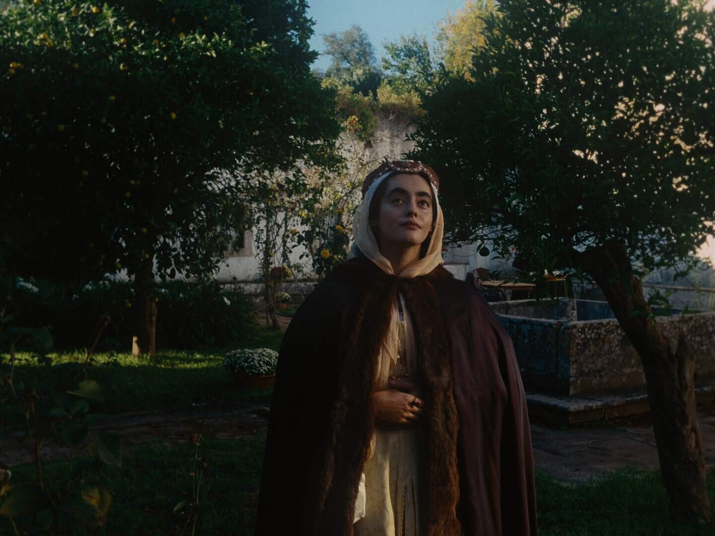 Still from "Magellan"; a woman looks off past the camera.