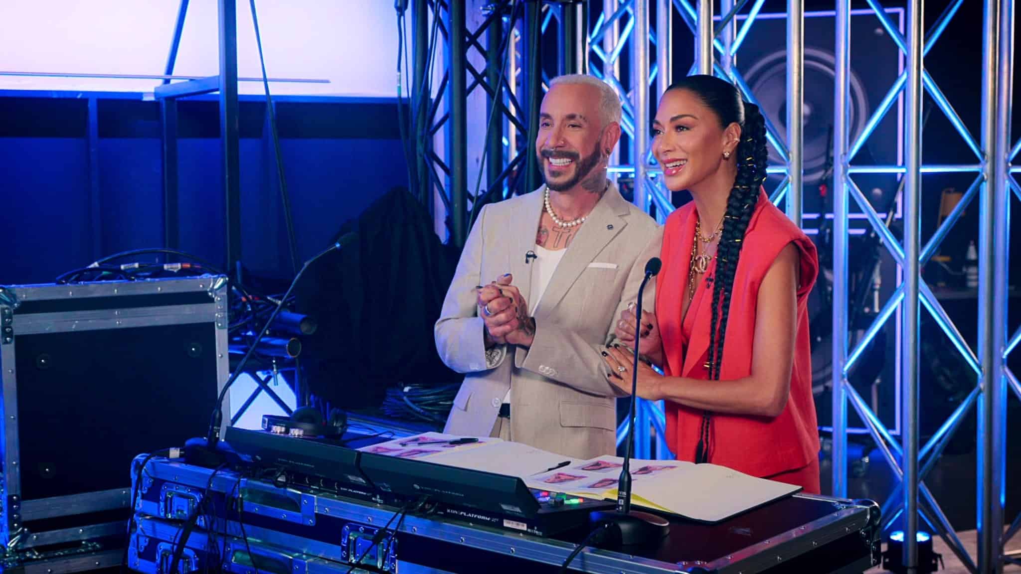 AJ Mclean & Nicole Scherzinger standing next to each other in Building the Band.