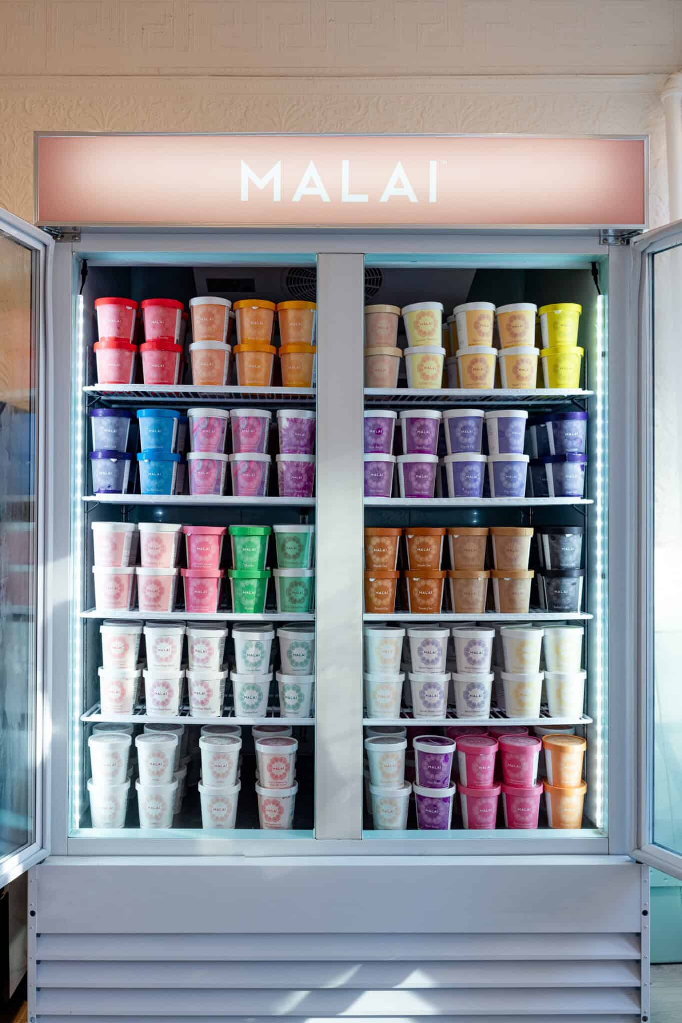 A freezer filled with different-colored pints of ice cream, with the name "Malai" at the top.
