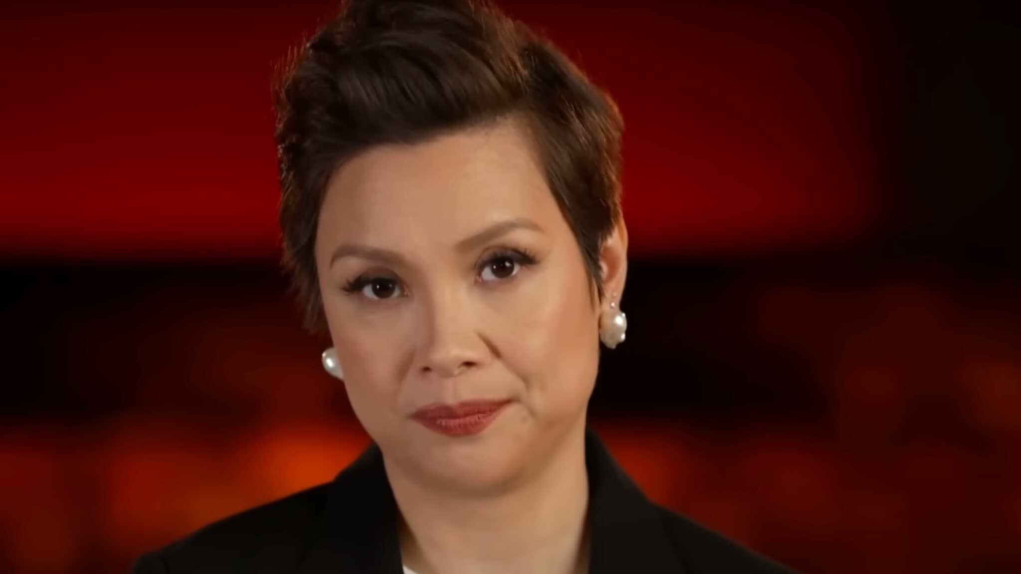 Lea Salonga sitting in red theater chair.