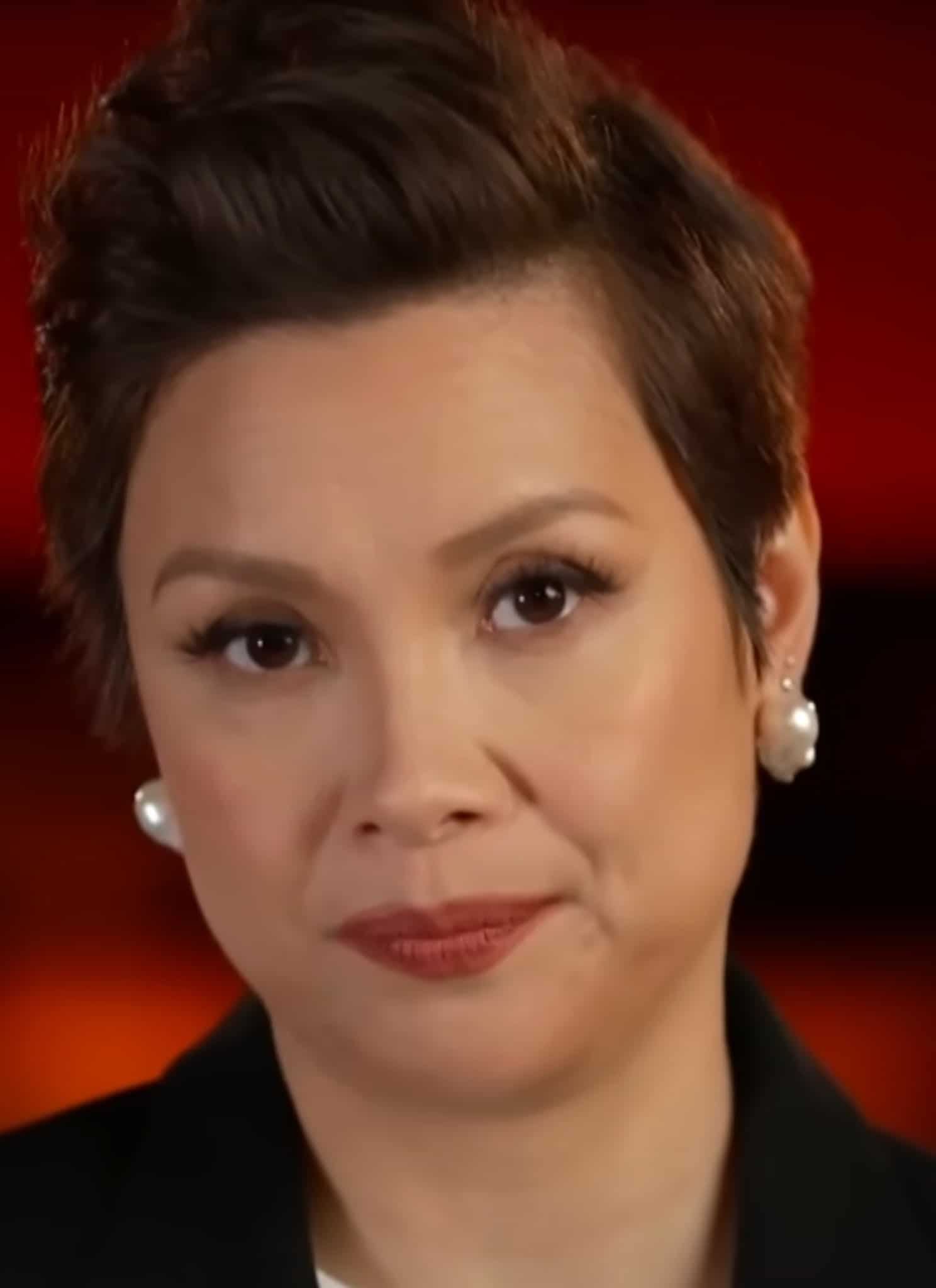Lea Salonga sitting in red theater chair.