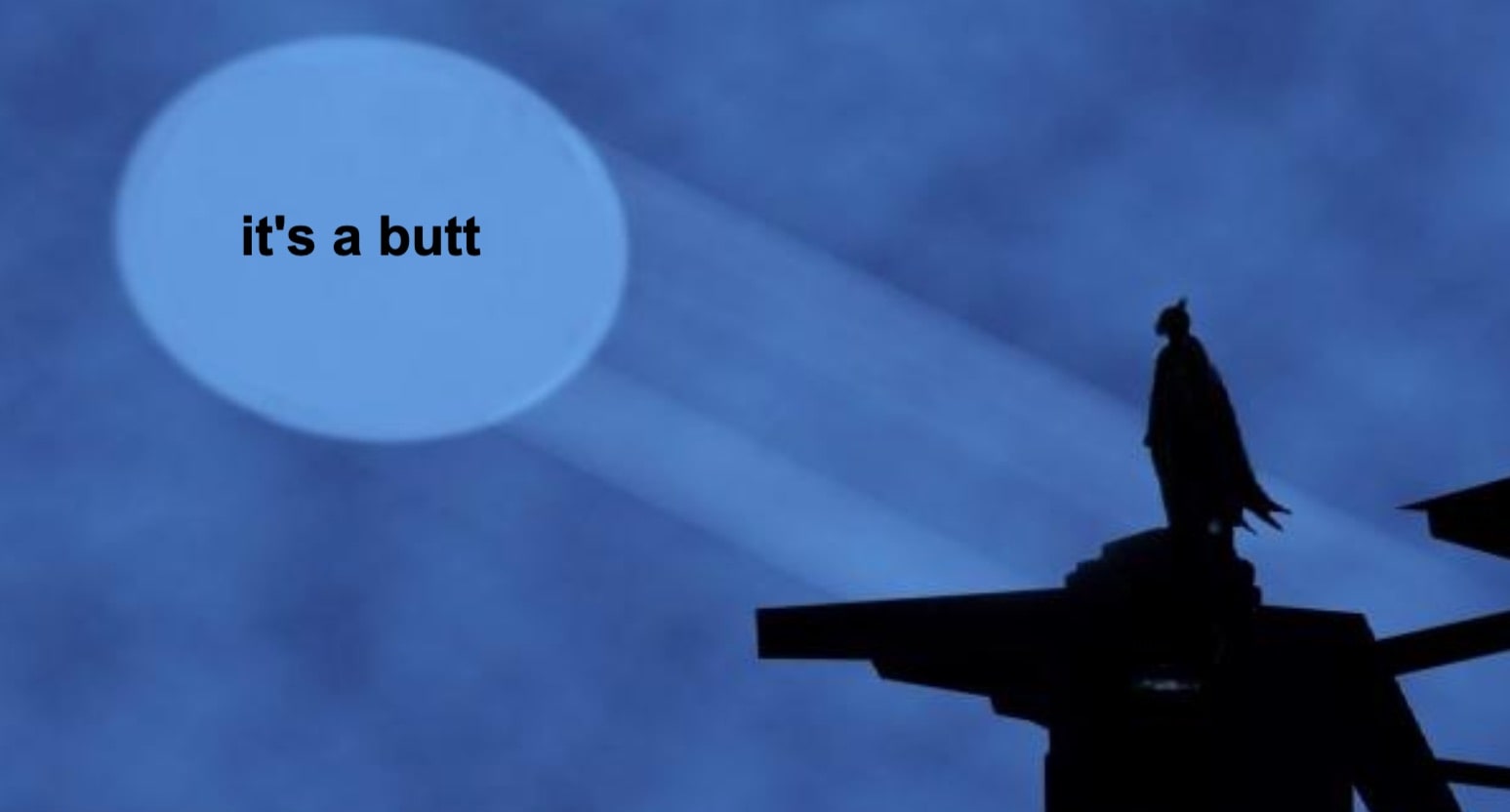A silhouette of a caped figure stands on a rooftop at night, looking toward a large spotlight in the sky. The spotlight beam displays the text its a butt instead of a symbol.