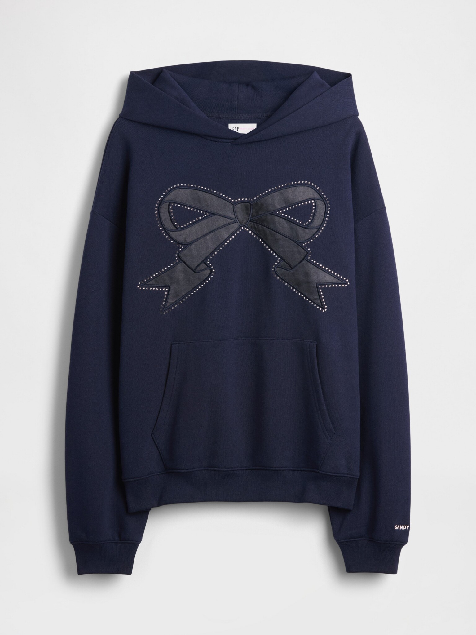 A navy blue hooded sweatshirt featuring a large black bow with dotted outline details on the front and a front pouch pocket.