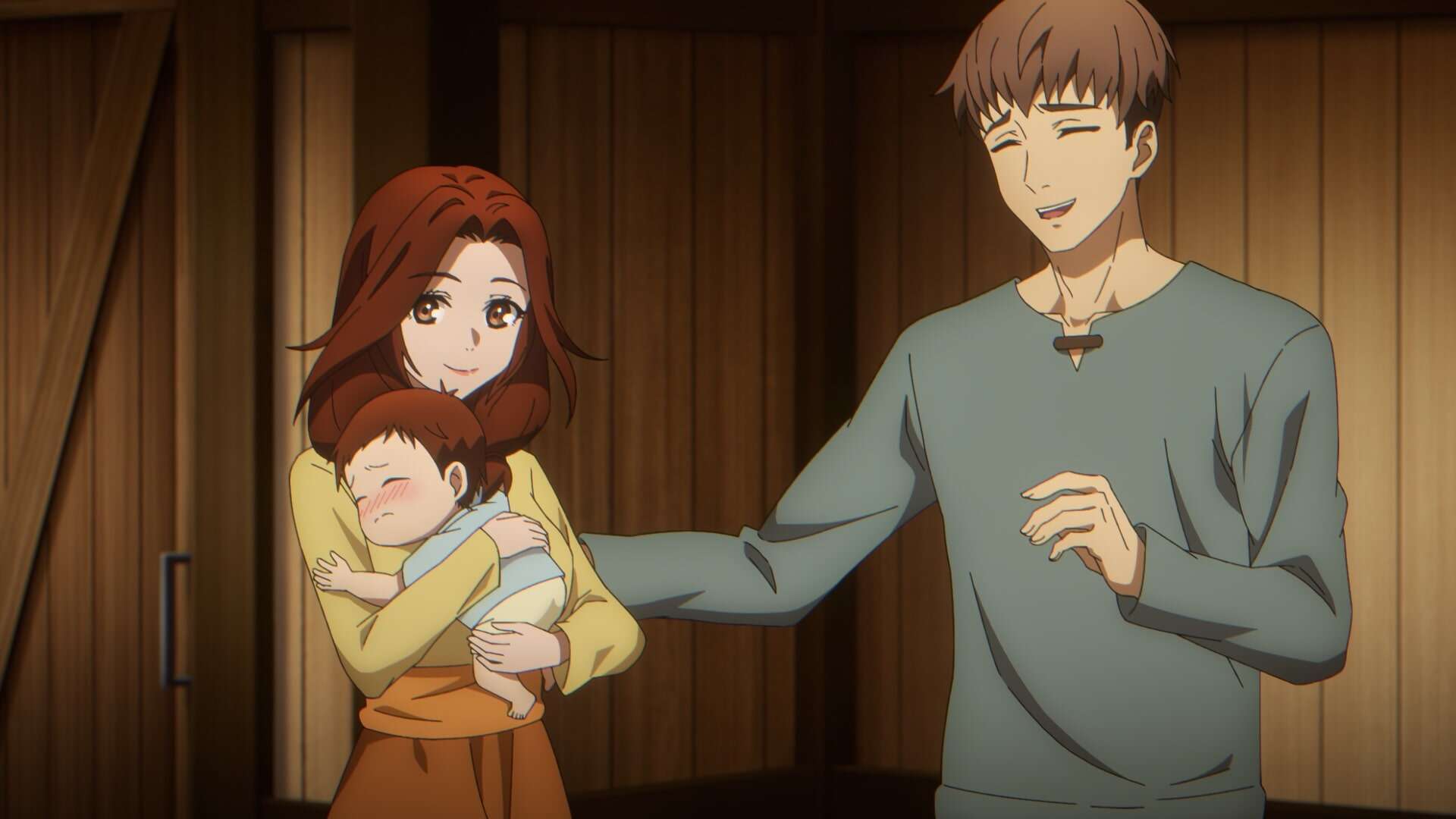 A woman with long brown hair holds a sleeping baby in her arms, smiling warmly. Next to her, a man with short brown hair stands smiling, with one hand gently reaching toward the baby. They are in a wooden room.