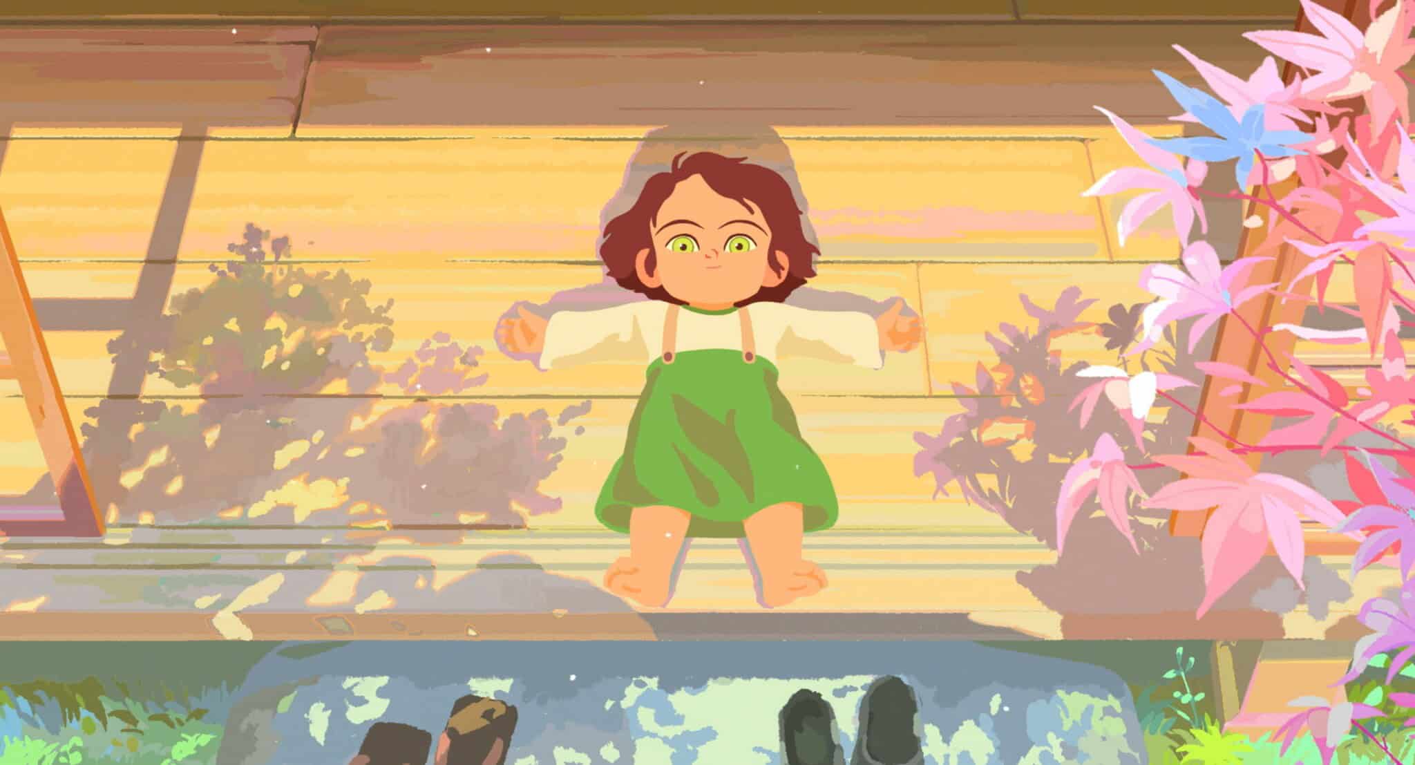 A child with brown hair and green eyes lies smiling on a sunlit wooden floor, arms outstretched. Colorful shadows from nearby pink and green plants fall across the scene. Shoes rest at the bottom of the image.