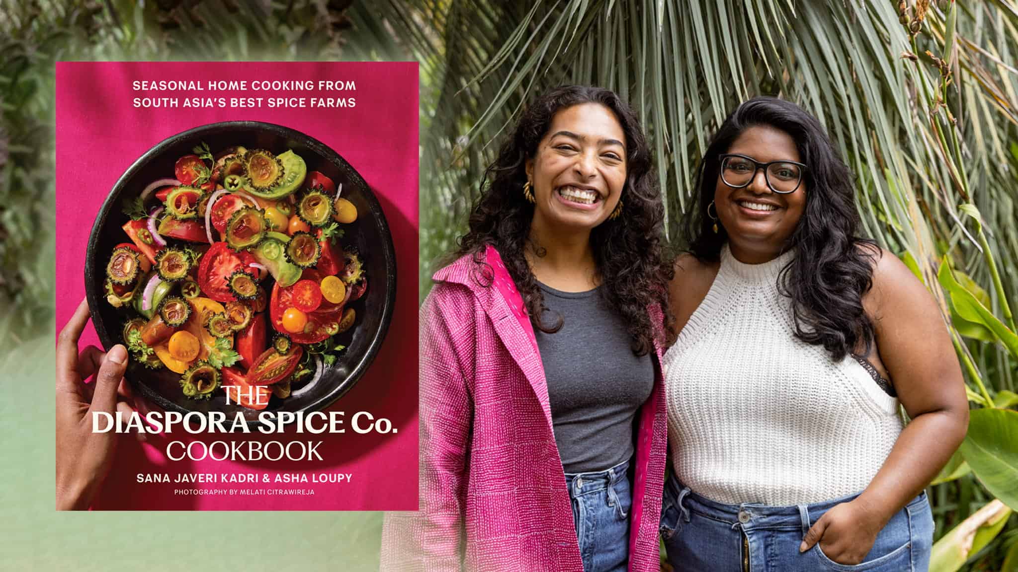 Two women stand smiling next to each other in front of green foliage. Beside them is the cover of The Diaspora Spice Co. Cookbook, featuring a colorful dish and text about South Asian home cooking.