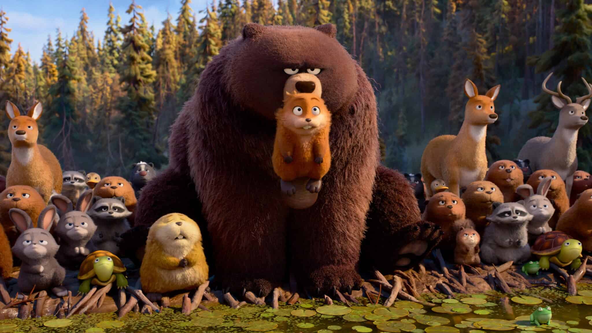 A large animated bear sits at the edge of a pond, holding a small, worried-looking beaver. Various animated forest animals, including deer, rabbits, turtles, and squirrels, gather around them in a forest setting.