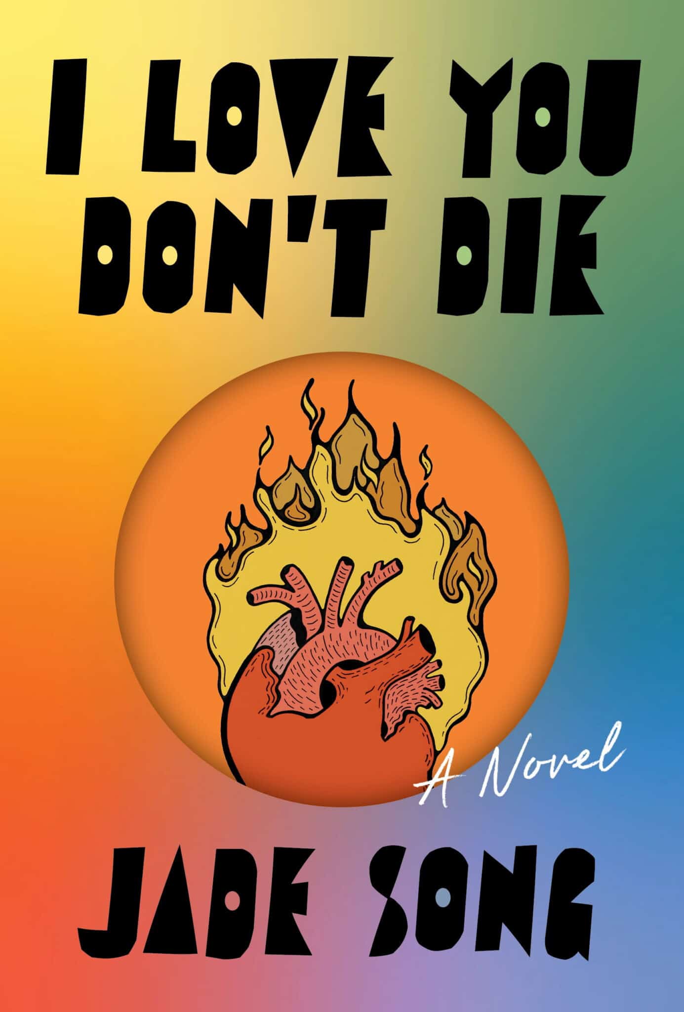 Book cover for I Love You Dont Die by Jade Song, featuring bold black text on a gradient rainbow background and an illustration of an anatomical heart surrounded by flames inside an orange oval.