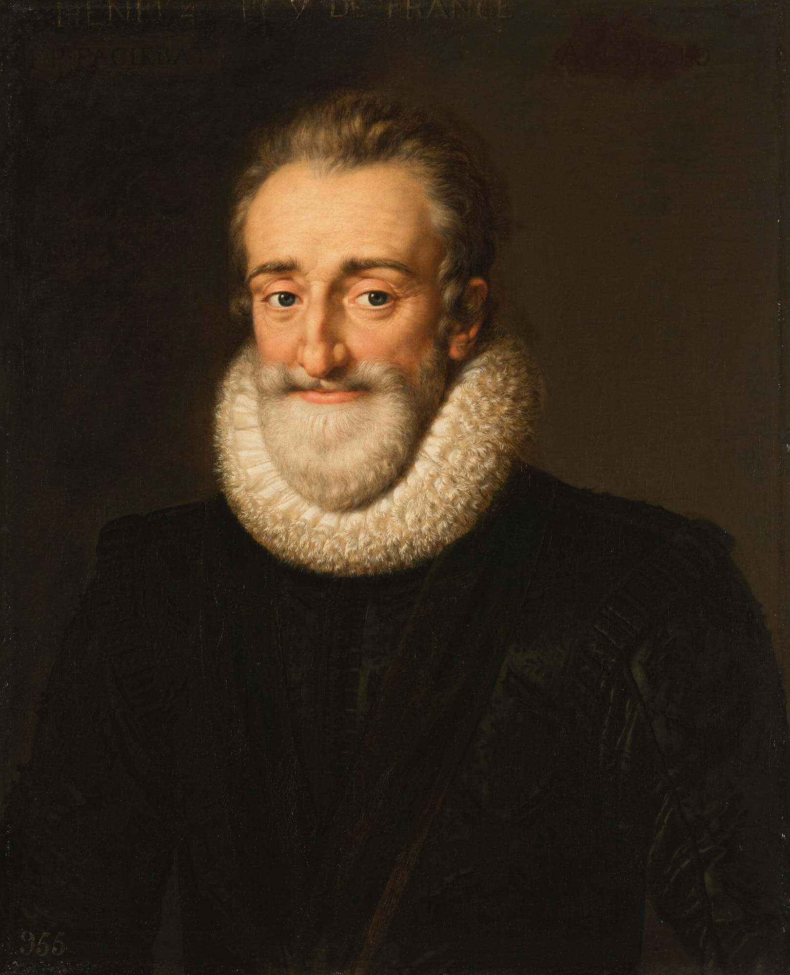 A portrait of a man with light skin, gray hair, and a beard, wearing a black outfit with a large, white ruffled collar against a dark background. The man is facing forward and smiling slightly.