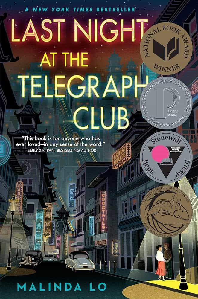 Book cover for Last Night at the Telegraph Club by Malinda Lo, featuring a neon-lit city street at night, two women standing under a streetlamp, and several award medals on the right side.
