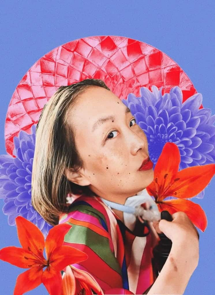 A woman with light skin and red lipstick poses in front of a collage background with purple and red flowers and a red textured pattern on a blue backdrop.