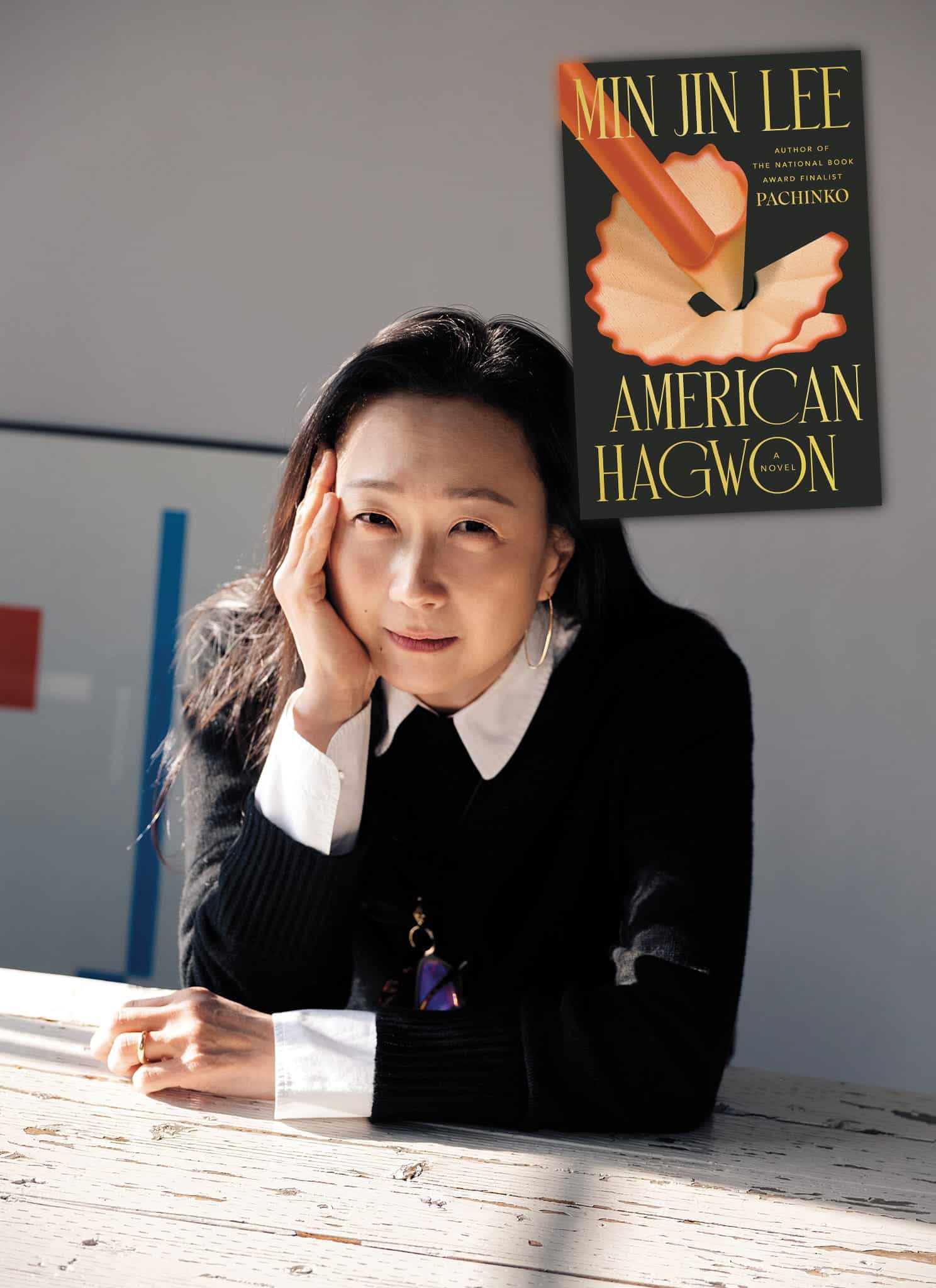 A woman sits at a table, resting her head on her hand, next to the book cover for American Hagwon by Min Jin Lee, which features a pencil shaving motif.