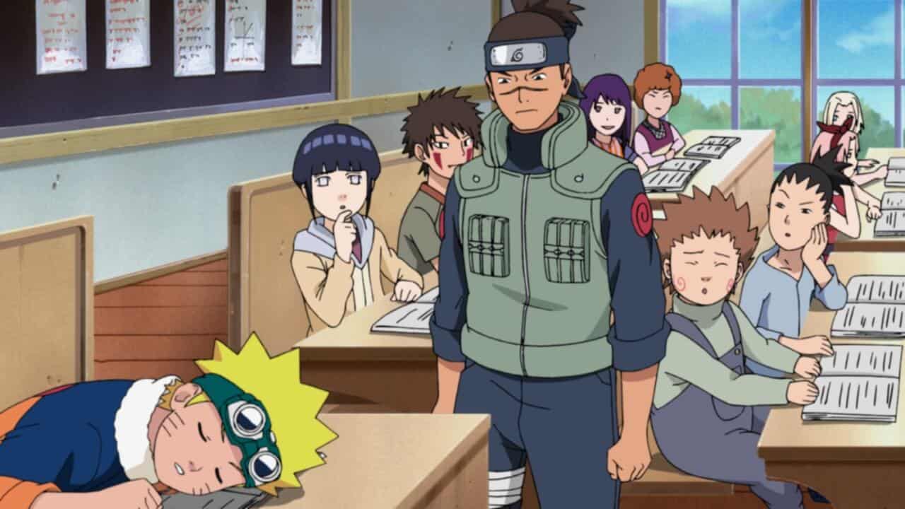 Cartoon classroom scene with a boy in orange asleep at his desk, students looking at him, and a serious man in a green vest standing nearby. Open books are on the desks and a window is in the background, reminiscent of a naruto-inspired classroom setting.