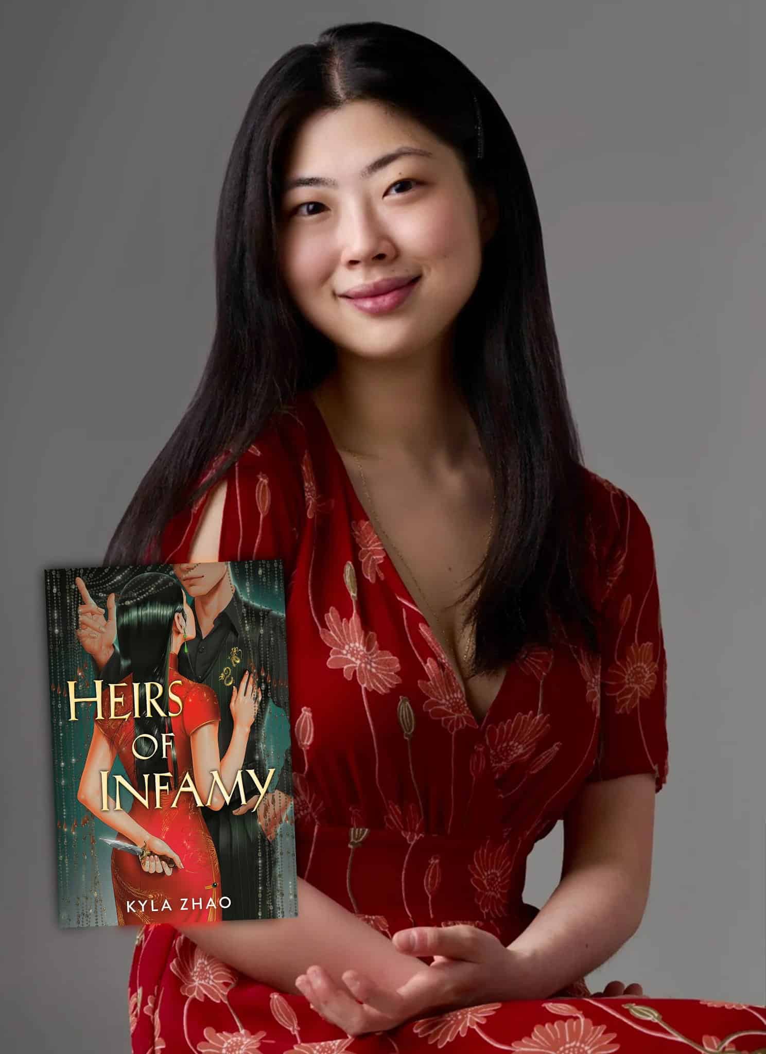 Author Kyla Zhao beside the cover of her book, Heirs of Infamy, which features an illustration of a woman in a red dress holding a knife behind her back.