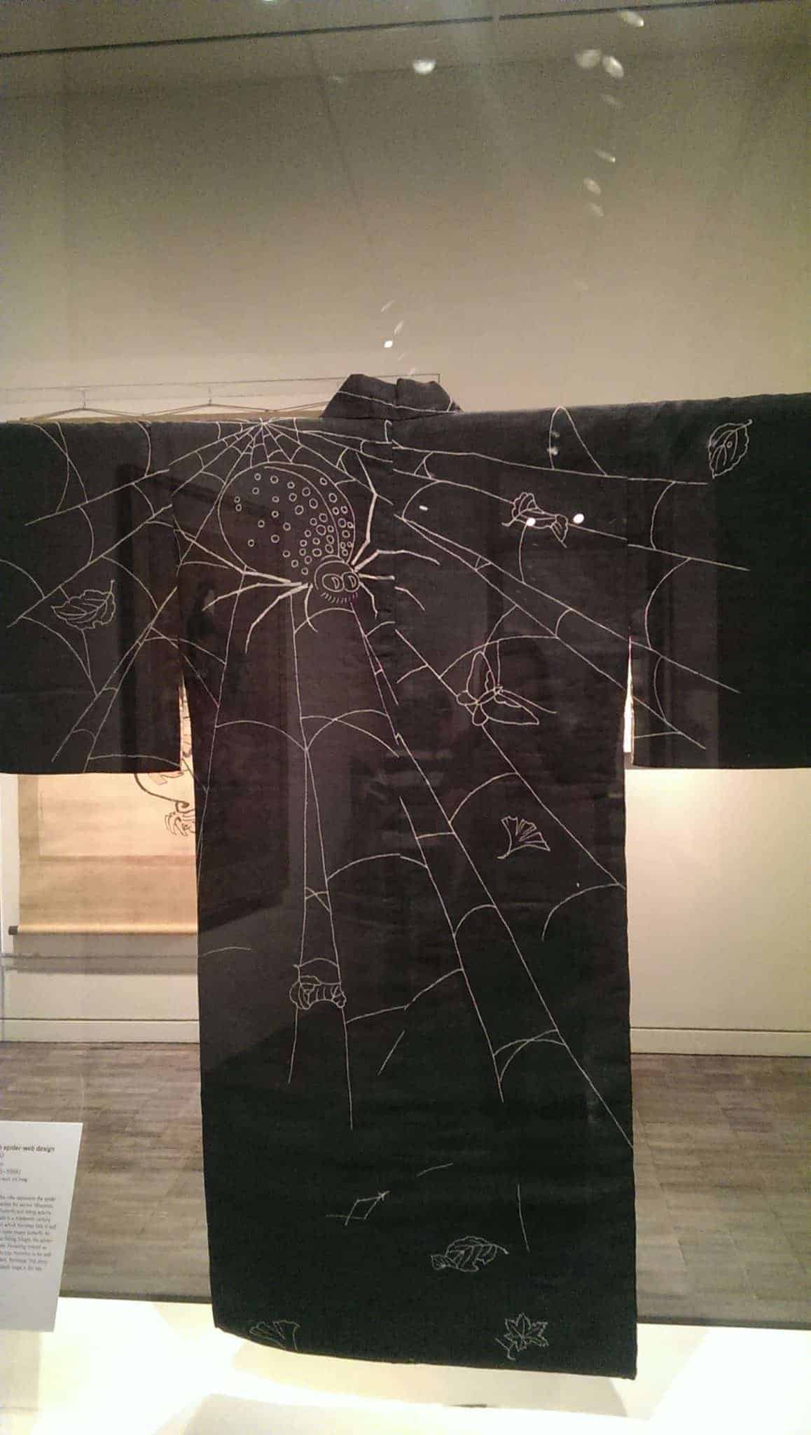 black kimono with white spider and web embroidery