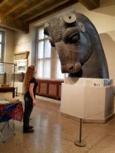 enormous bull head (missing ears and horns) from Persepolis, with Laura, photographed at the Oriental Institute of the University of Chicago
