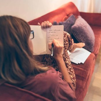 woman-writing-in-notebook-expanded